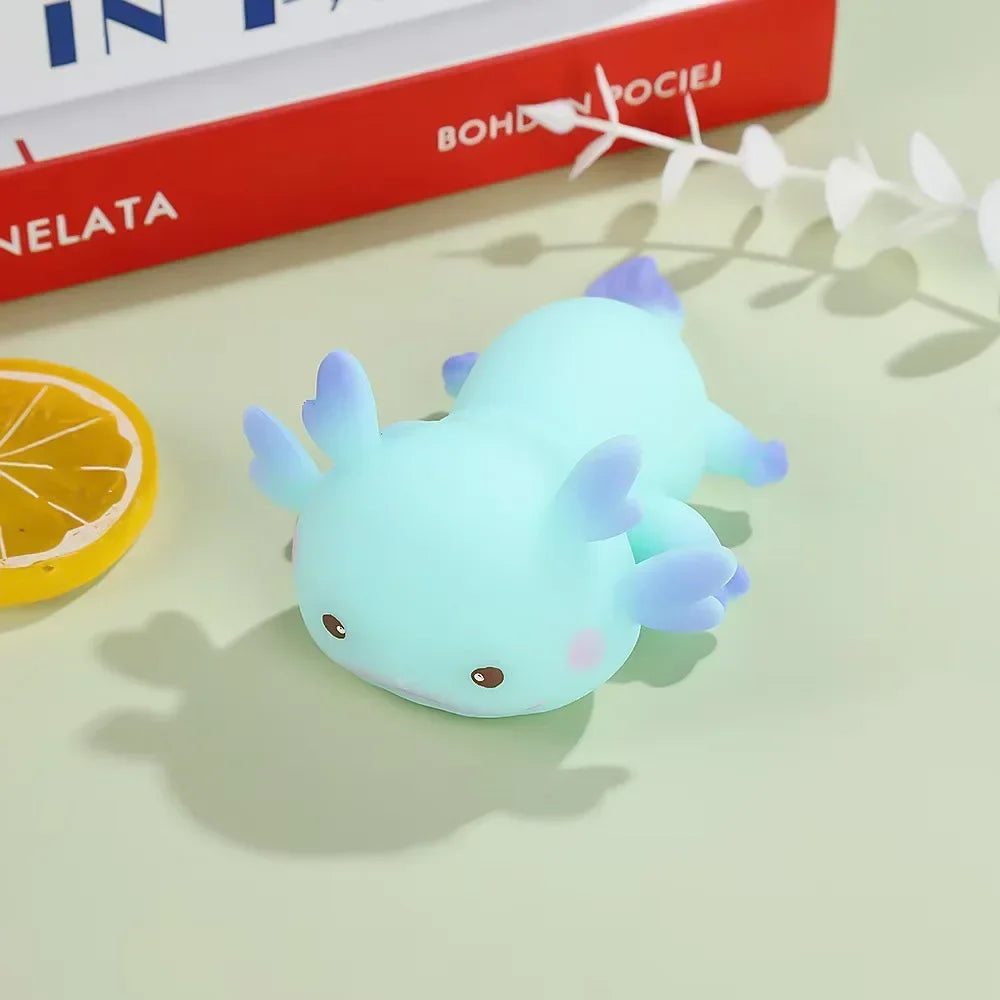 A blue axolotl squishy with pale gills, shown side on.