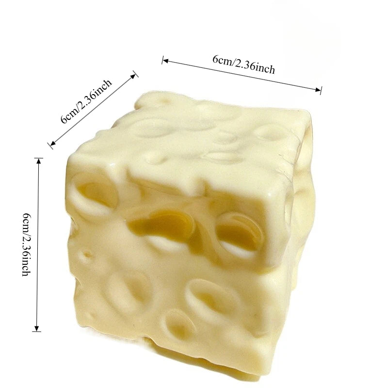 A cheese cube squishy from another angle, showing the 6cm dimensions and hole detail.