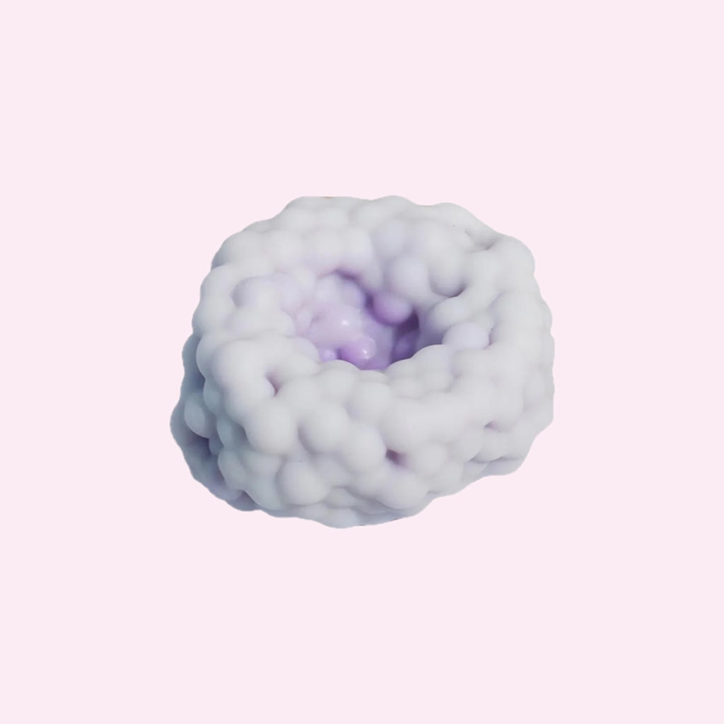Purple bobbly textured squishy stress ball on a pink background - Trendy Toyz AU