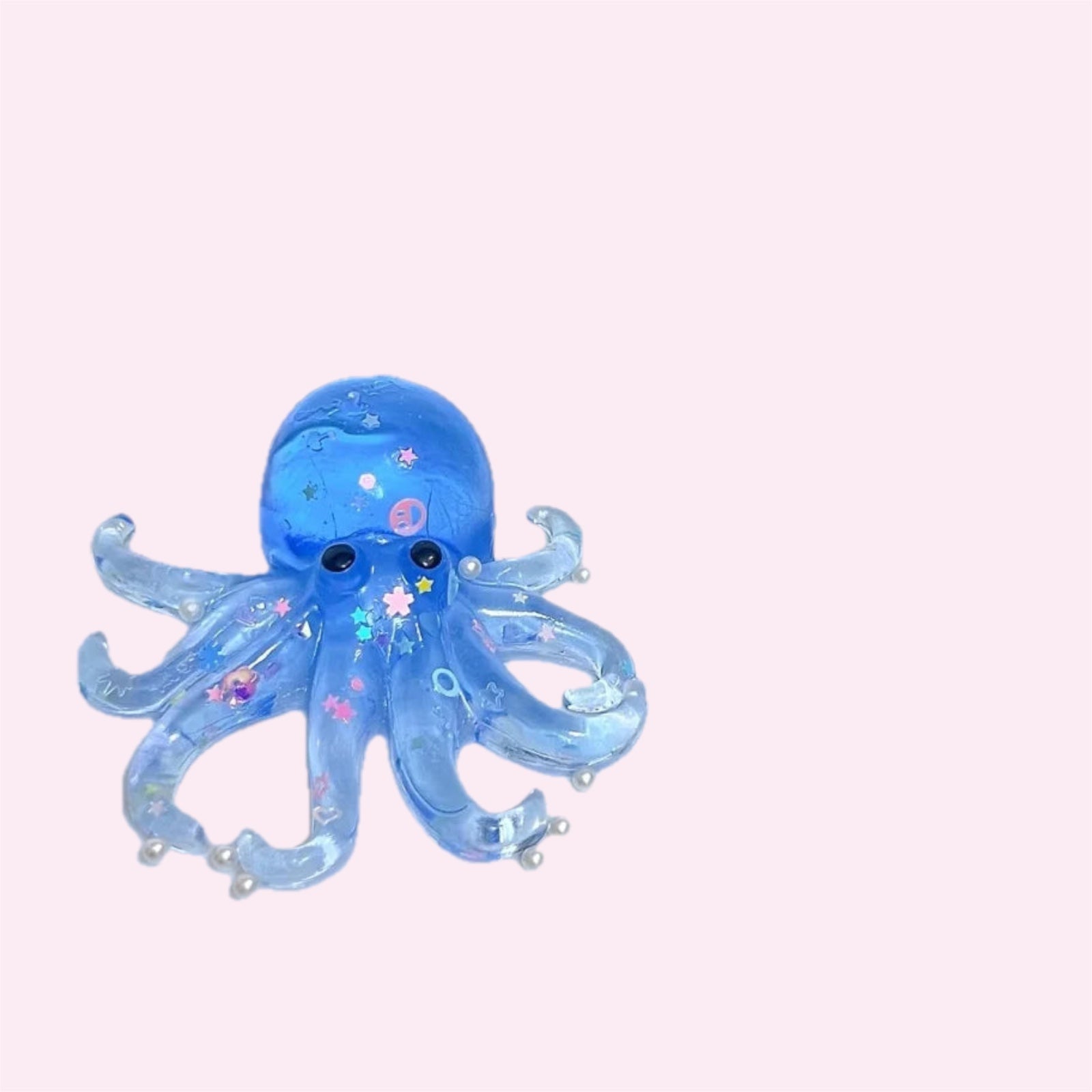 Blue glitter octopus squishy with soft tentacles on a pink background - Trendy Toyz AU