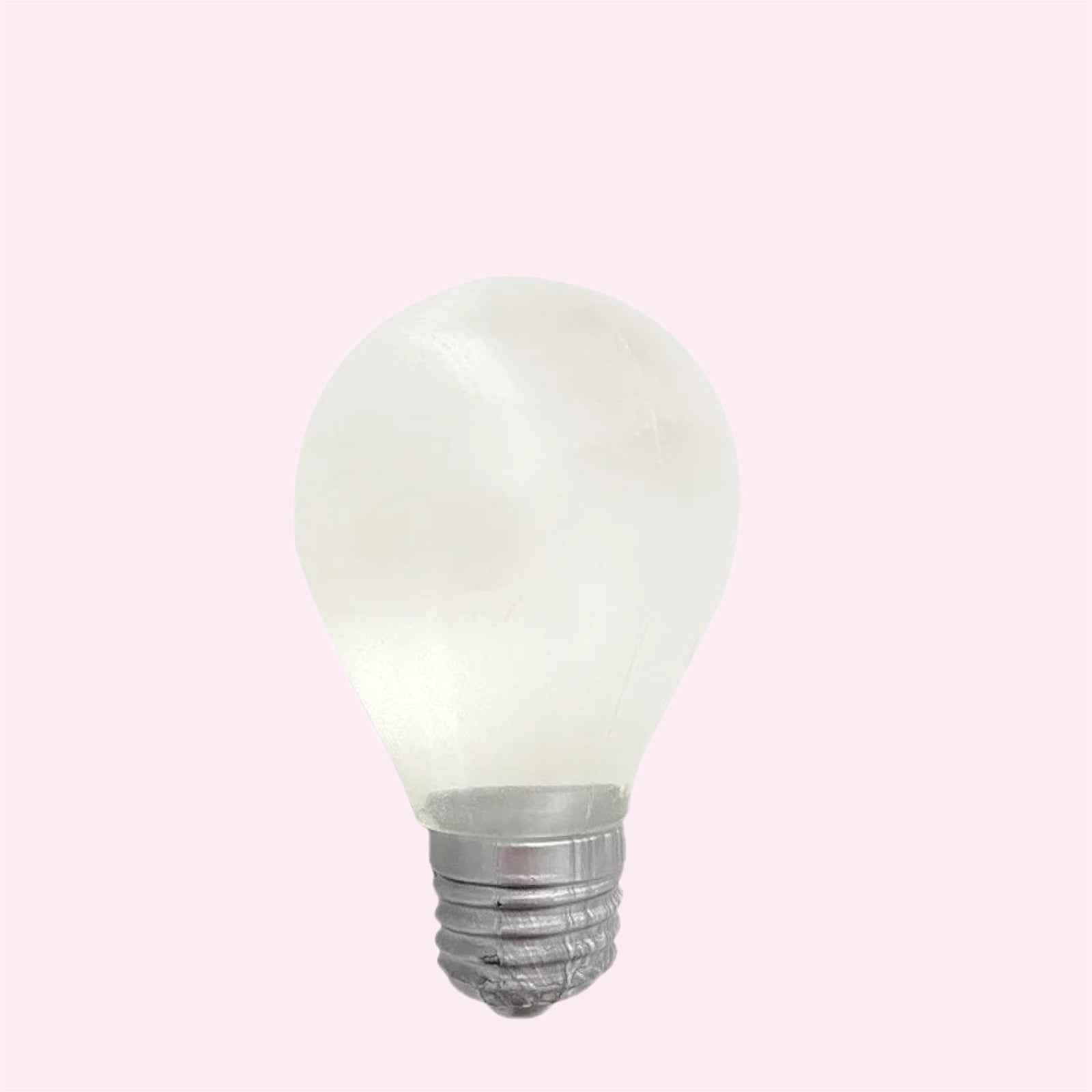 Glow in the dark lightbulb squishy, a soft slow rise fidget toy, on a pink background - Trendy Toyz AU