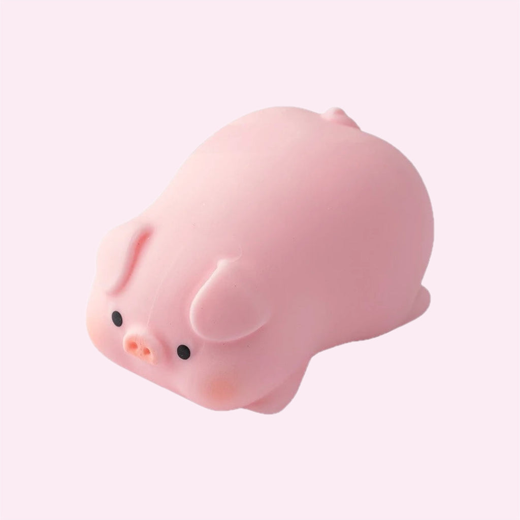 Pink piggy mochi squishy, a small soft sensory fidget toy, on a pink background - Trendy Toyz AU