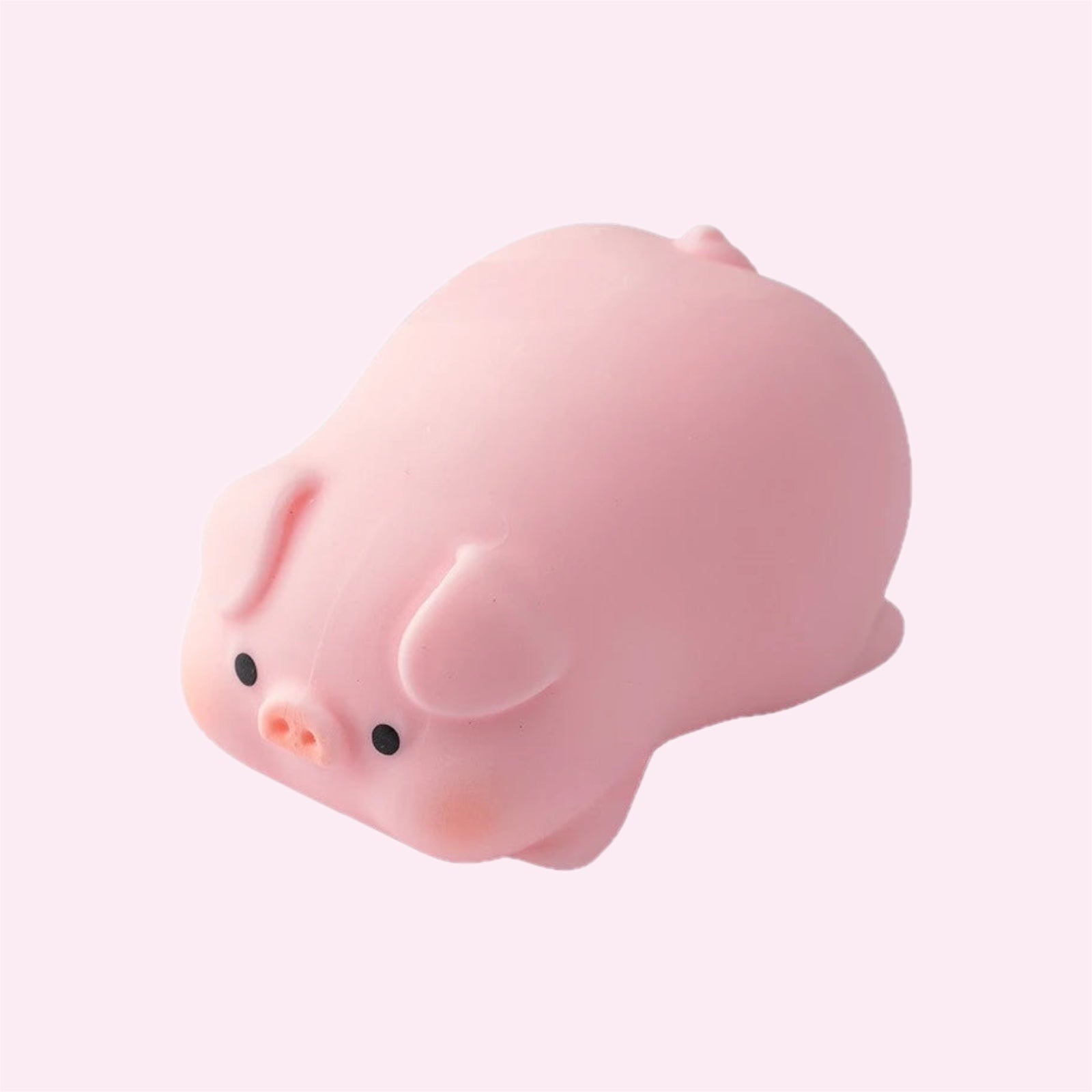 Pink piggy mochi squishy, a small soft sensory fidget toy, on a pink background - Trendy Toyz AU